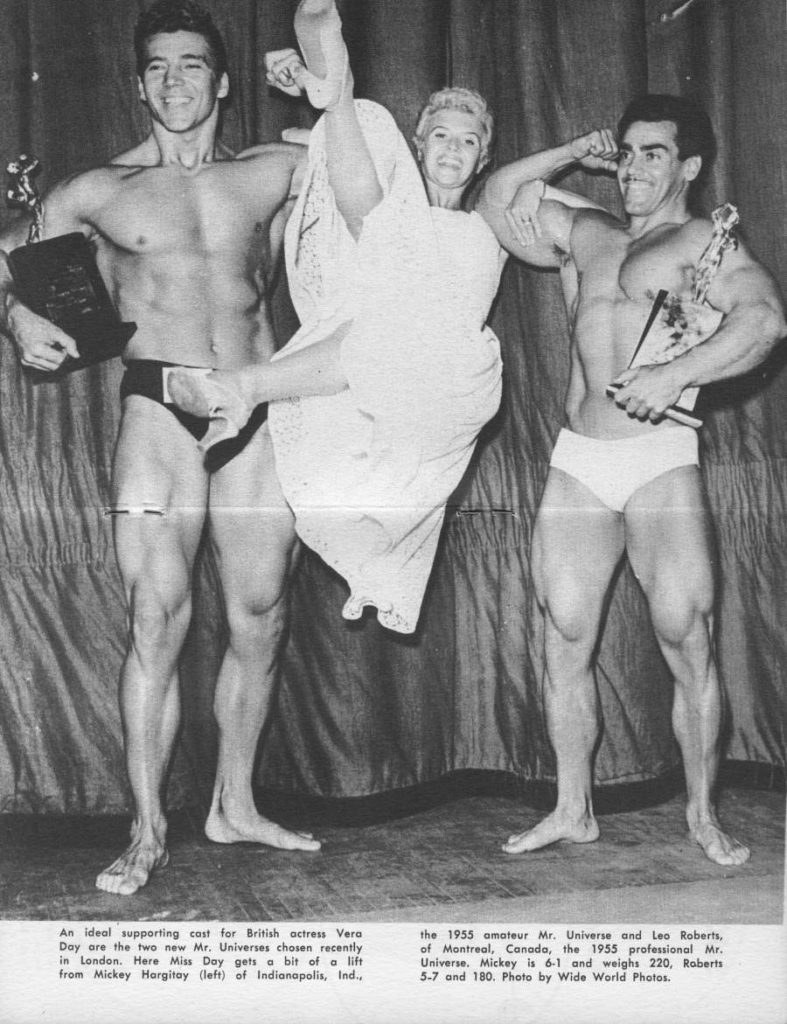 An ideal supporting cast for British actress Vera Day are the two new Mr. Universes chosen recently in London. Here Miss Day gets a bit of a lift from Mickey Hargitay (left) of Indianapolis, Ind.,
the 1955 amateur Mr. Universe and Leo Roberts, of Montreal, Canada, the 1955 professional Mr. Universe. Mickey is 6-1 and weighs 220, Roberts 5-7 and 180. Photo by Wide World Photos.