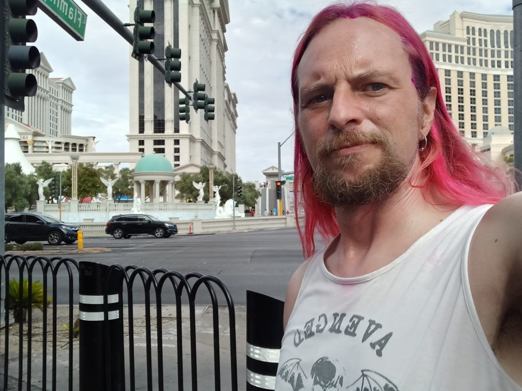 Pink haired Jack Drago at the corner of Flamingo and the Las Vegas Strip.