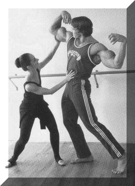 Arnold learns to pose from a  ballet 
dancer.