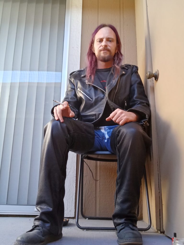 Smoking in full leathers.