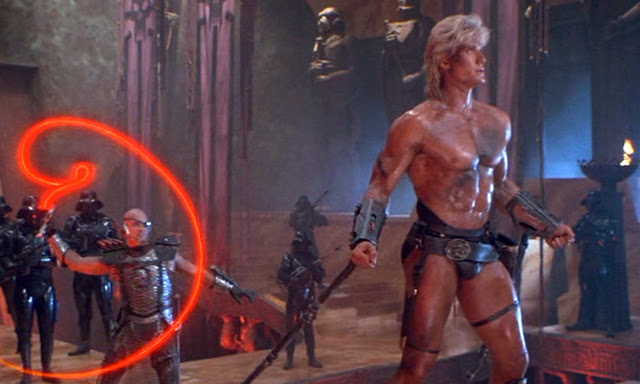 Dolph Lundgren shows off his famously muscular body in Conan the Barbarian and other roles.