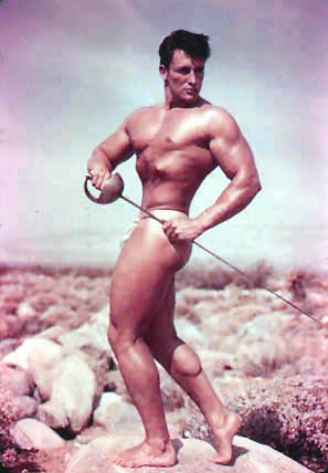 Vintage bodybuilder poses with sword for Bruce Belas