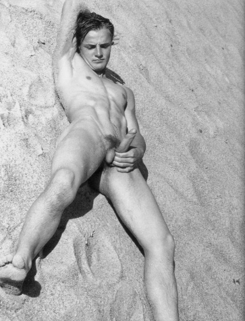 Nude and erect on the beach. 