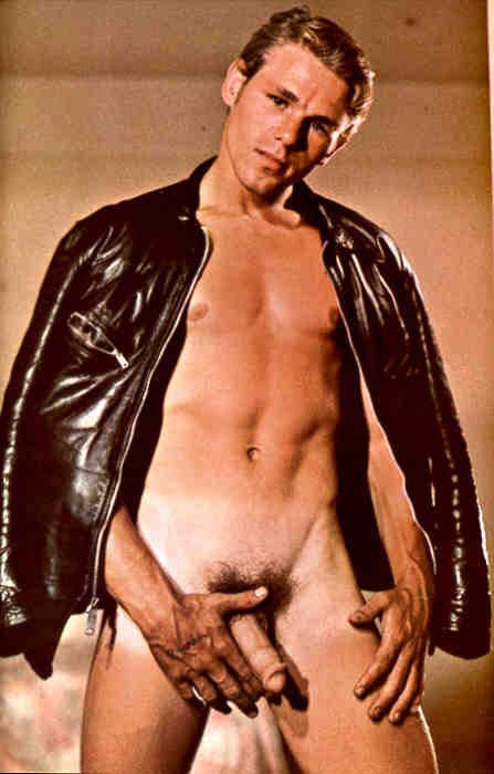 1960s vintage porn scan of a man in a leather jacket with no clothes underneath.