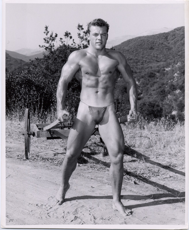 Hugh Pendleton photographed with a knife in black and white outside.